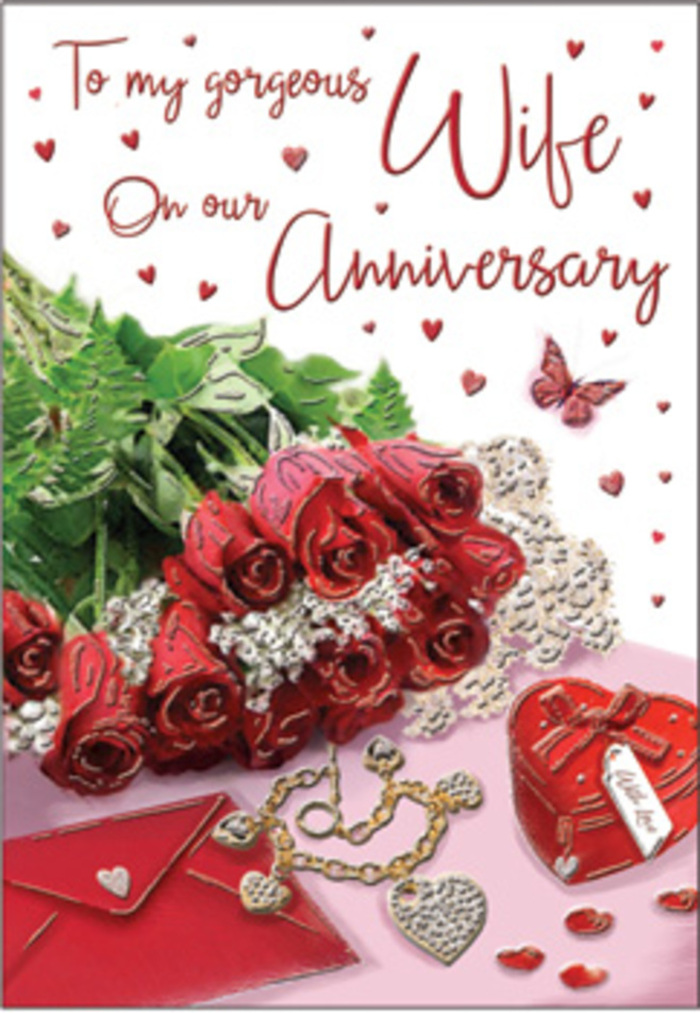 This anniversary card image unfolds as a richly emotive tableau, reminiscent of a carefully styled window display near Soho Square, where every detail tells part of a love story. At the centre is a bouquet of classic red roses, each bloom luxuriously full and perfectly formed, their velvety petals layered in deep, confident scarlet. The roses are elegantly wrapped and surrounded by lush greenery, the leaves adding both structure and softness, suggesting nature's abundance amid the urban energy of Soho. Nearby, a vivid red box-shaped and sized like a jewellery gift-glows with a satin finish, hinting at treasured surprises exchanged over past anniversaries. Resting close by is a jewellery set that catches the light in fine threads of gold and silver, recalling evenings spent under the warm glow of theatre lights along Shaftesbury Avenue. Scattered heart motifs, some printed and others appearing as tiny embellishments, dance across the background, connecting the different elements and framing the central bouquet. Wisps of lace and glimpses of tactile fabrics-velvet, silk, perhaps a hint of satin ribbon-add layers of texture and softness. The scripted message on the card is written in sweeping, elegant strokes, embracing the roses like a whispered promise. The light is gentle and diffused, with soft reflections on the metallic accents and faint shadows that give the arrangement dimensionality. Overall, the scene feels like a warm embrace translated into petals and keepsakes, ideal for marking an anniversary that is both stylish and deeply sentimental in the heart of Soho.